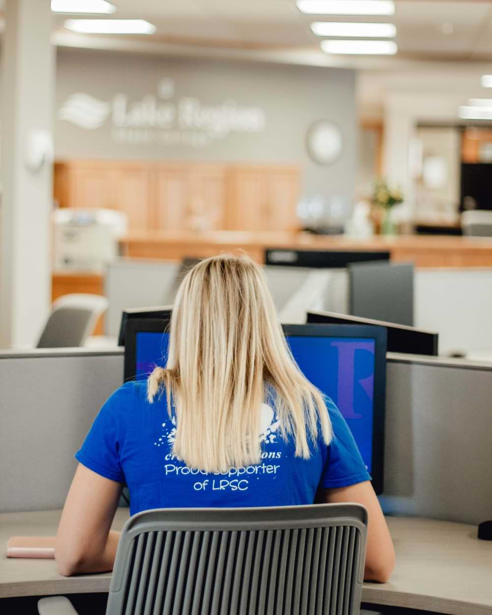 Woman working at a computer in a lab